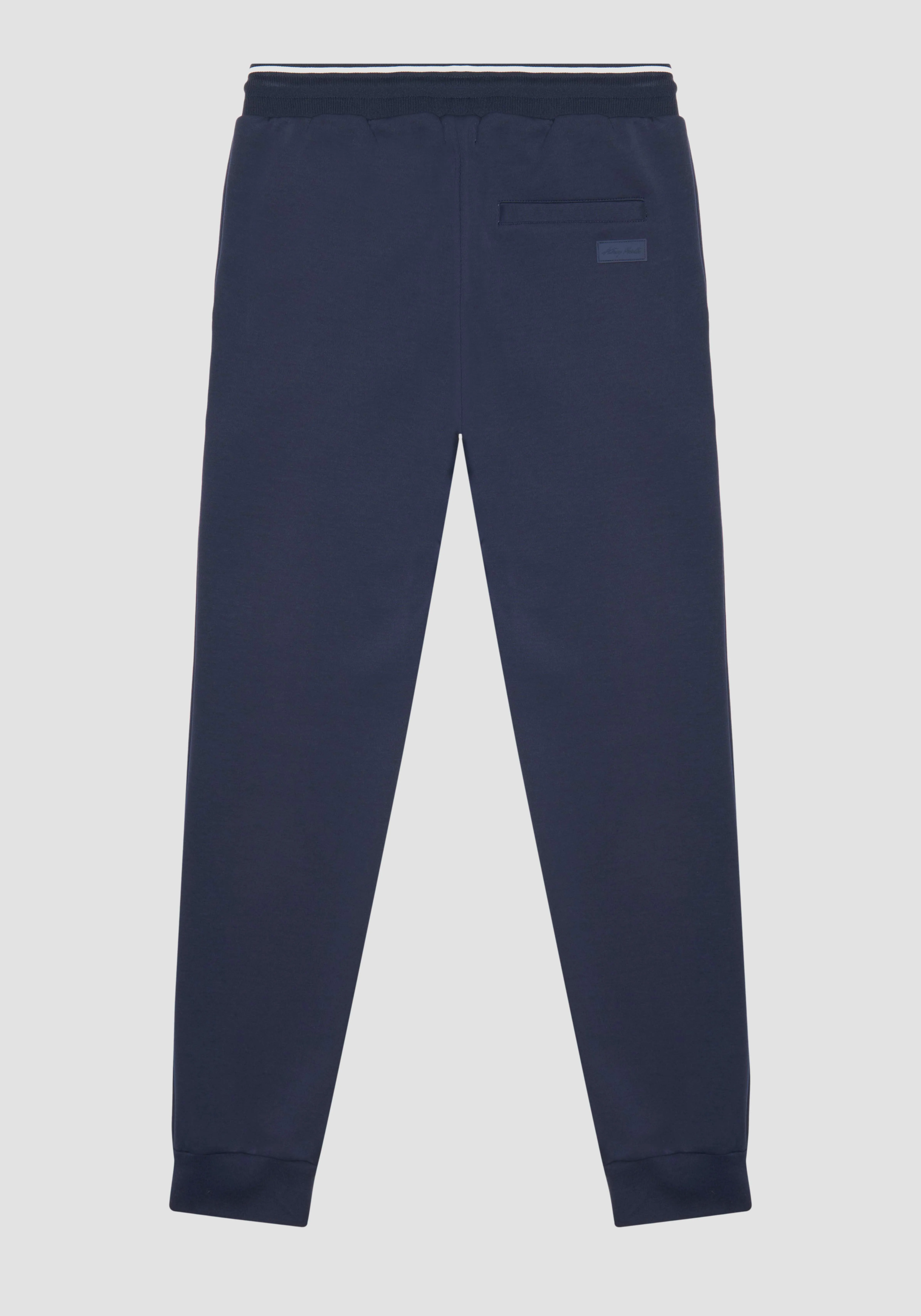PANTALONI SLIM FIT IN FELPA MISTO COTONE CON PATCH LOGATA